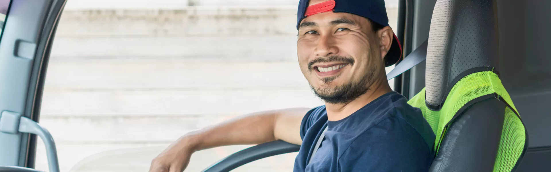 smiling man sitting on vehicle chair