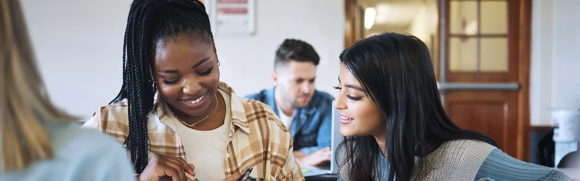 students in classroom for working together on university, college or school research project